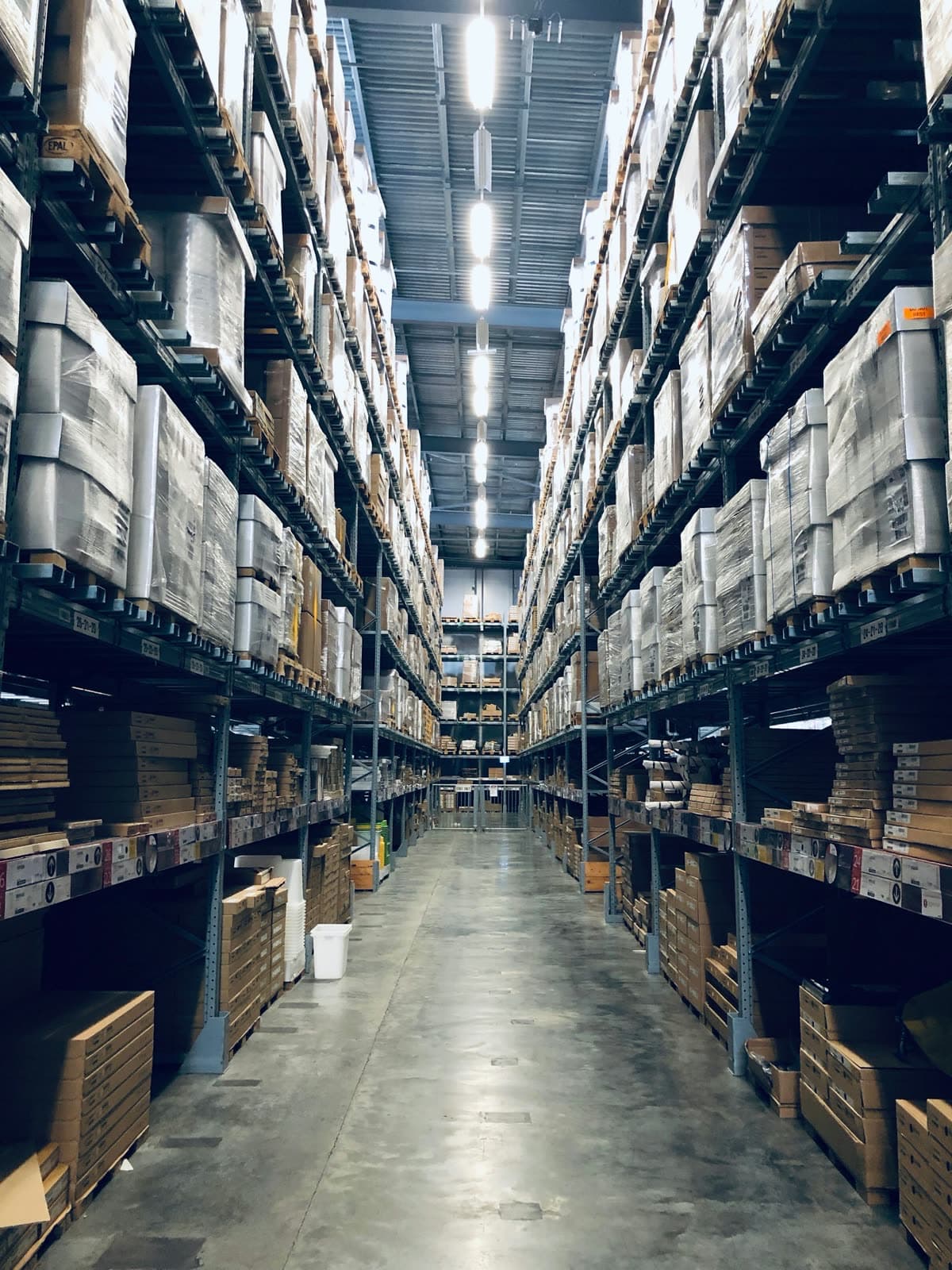 Aisle of packed freight on warehouse racks